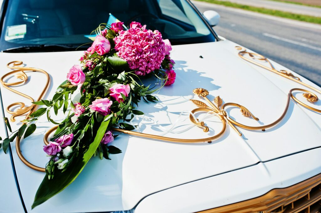 Elegance wedding limousine car with floral decoration.